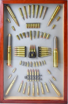 Lot 477 - A display board of inert military cartridges...