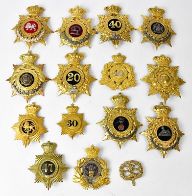 Lot 494 - A collection of fourteen regimental helmet...
