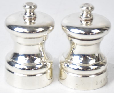 Lot 594 - A. J. POOLE; a pair of Elizabeth II hallmarked...