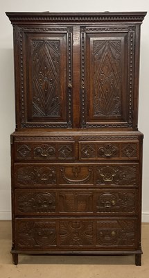 Lot 468 - A 19th oak carved cupboard, the base with two...