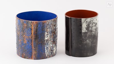 Lot 740 - Two cylindrical earthenware vessels covered in...