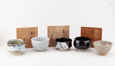 Lot 729 - A group of five Japanese stoneware chawan by...