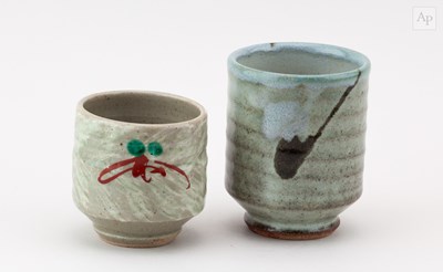 Lot 745 - A stoneware yunomi covered in mottled grey...