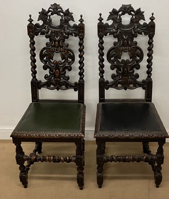 Lot 558 - A pair of 19th century carved oak hall chairs...
