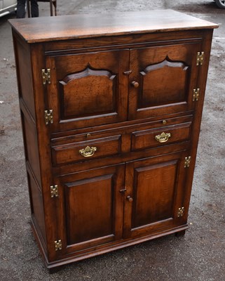 Lot 1727 - TITCHMARSH & GOODWIN, a reproduction oak cocktail cabinet
