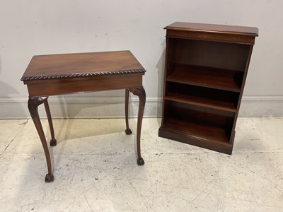Lot 1149 - A mahogany fold-over games table with baize...
