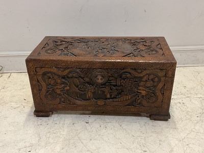 Lot 1095 - A carved Chinese camphorwood blanket chest,...