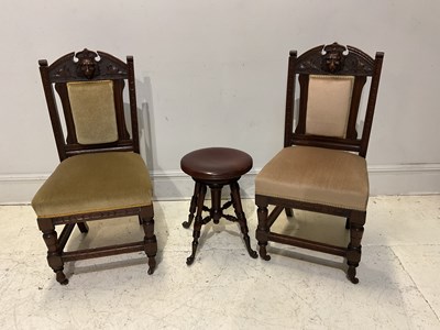 Lot 1150 - A pair of oak hall chairs, with carved backs...