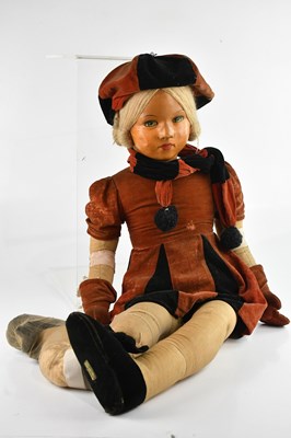 Lot 692 - DEAN'S RAG BOOK; a large cloth doll with...