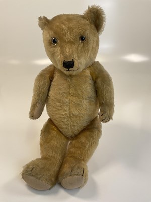 Lot 79 - A 1960s teddy bear with movable limbs, glass...