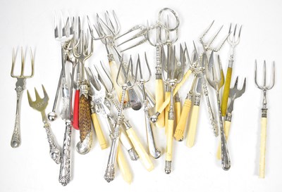 Lot 553 - A collection of bread forks of various sizes,...