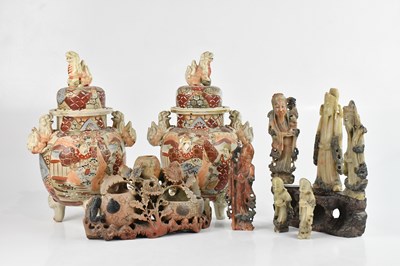 Lot 366 - A collection of soapstone figures, with stand,...