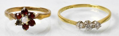 Lot 671 - A 9ct yellow gold floral cluster ring set with...