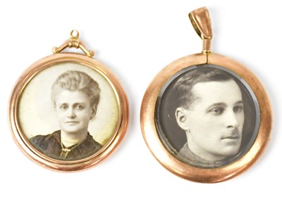 Lot 737 - Two 9ct gold photograph frame pendants,...