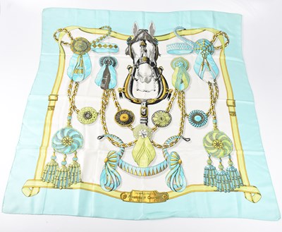 Lot 1182 - HERMÈS; a 100% silk ‘Frontaux et Cocardes’...
