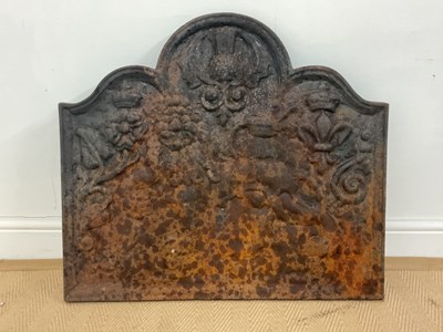 Lot 145 - A Victorian cast iron fire back decorated with...
