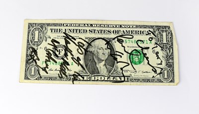 Lot 539 - PAUL MCCARTNEY; a US $1 banknote bearing the...