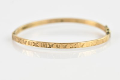 Lot 127 - A 9ct yellow gold hinged snap bangle, with...