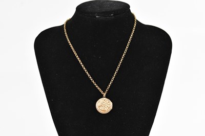 Lot 378 - A gold plated circular locket, suspended on a...