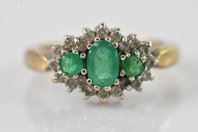 Lot 602 - A 9ct yellow gold cluster ring set with three...