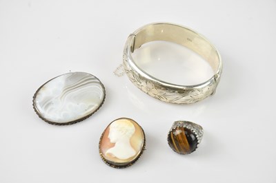 Lot 728 - A hallmarked silver hinged snap bangle, a...