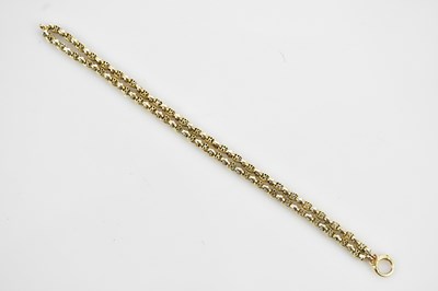 Lot 123 - A yellow metal bracelet, formed of two fancy...