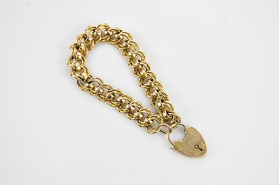 Lot 101 - A 9ct gold fancy link bracelet, with padlock...