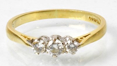 Lot 682 - An 18ct gold ring claw set with three...