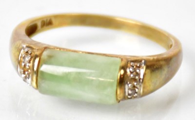 Lot 666 - A 9ct gold ring set with jade lozenge with...