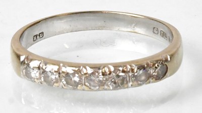Lot 693 - An 18ct white gold half eternity ring set with...