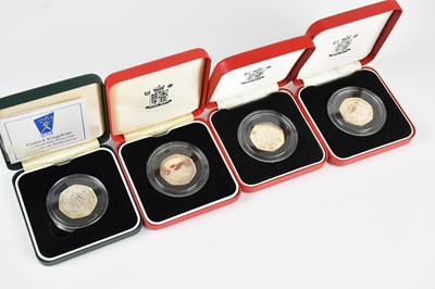 Lot 597 - A group of four silver proof 50p coins...