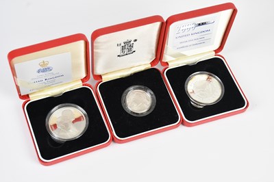 Lot 598 - A group of three silver proof commemorative...