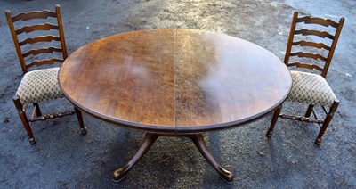 Lot 1725 - A reproduction oak oval extending dining table