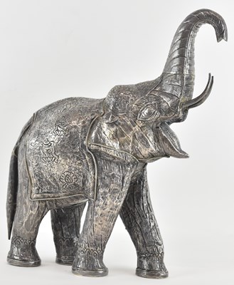 Lot 1135 - An Indian silver overlaid figure of an...
