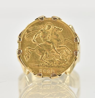 Lot 1202 - A George V half sovereign, 1913, in 9ct yellow...