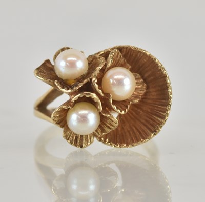 Lot 1221 - A 9ct yellow gold cultured pearl set florally...