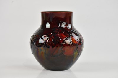 Lot 11 - WALTER MOORCROFT; a good flambé squat vase of...