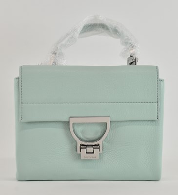 Lot 479 - COCCINELLE; a lady's turquoise leather handbag,...