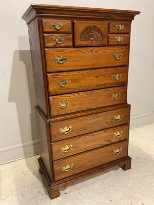Lot 1062 - A reproduction oak chest on chest with an...