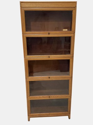Lot 1068 - A Globe Wernicke style light oak five section...