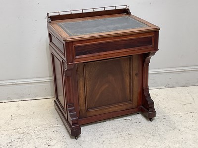 Lot 1134 - A Victorian walnut Davenport, with brass...