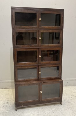 Lot 1130 - A Minty style stained pine five section...