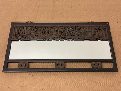 Lot 257 - A 19th century Chinese ebonised wall mirror...