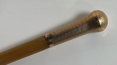 Lot 379 - A rhinoceros horn swagger stick with yellow...