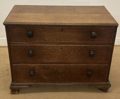 Lot 522 - An oak chest of three long drawers, height...