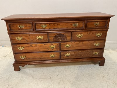 Lot 1101 - A reproduction oak chest with an arrangement...