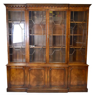 Lot 1722 - A reproduction mahogany breakfront bookcase,...