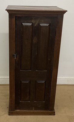 Lot 552 - A small oak cupboard with a single door...