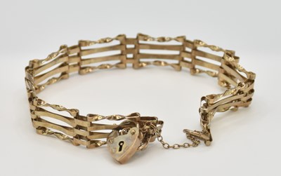 Lot 1463 - A 9ct four bar gate link bracelet, united with...