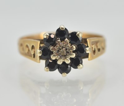 Lot 1314 - A 9ct yellow gold cluster ring, with central...